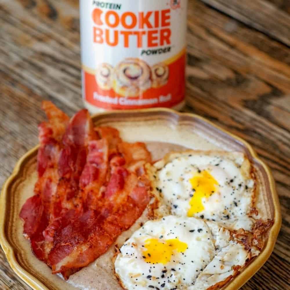 Protein Cookie Butter Cinnamon Roll Oats topped with Crispy Bacon & Runny Fried Eggs!